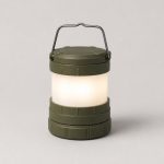 Olive green collapsible LED camping lantern glowing warm white