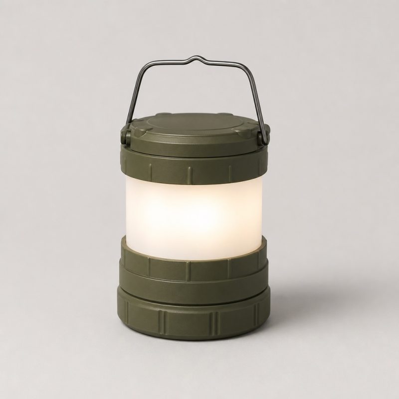 Olive green collapsible LED camping lantern glowing warm white
