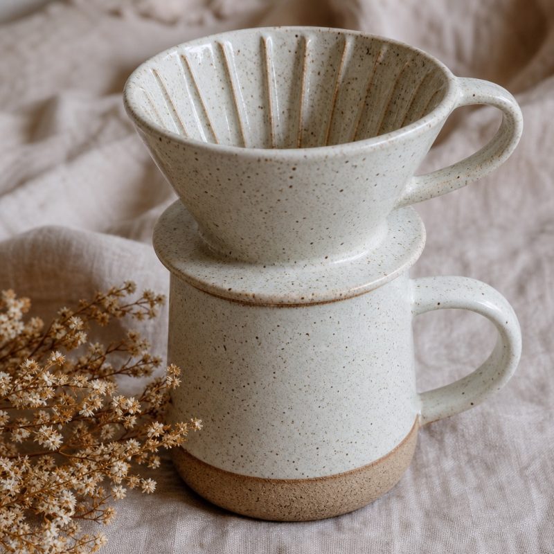 Close-up of hand-thrown ridges and glaze speckles